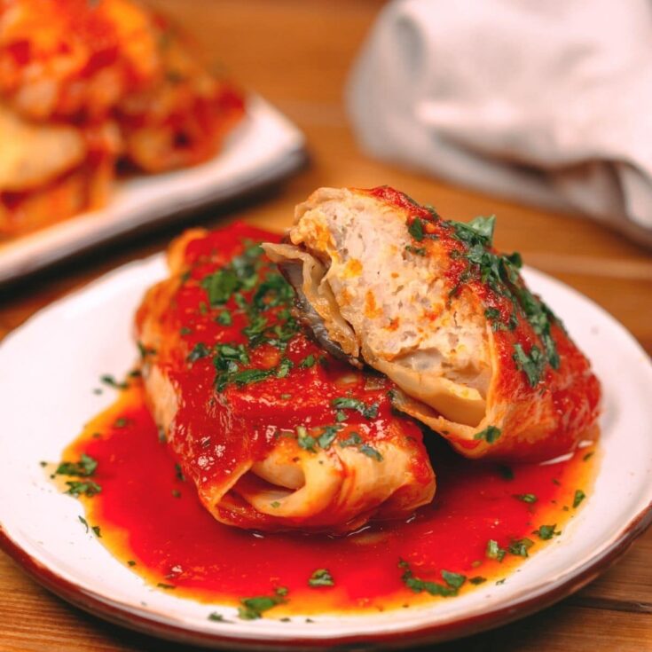 Stuffed cabbage rolls on white plate