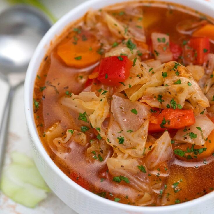 White bowl of cabbage vegetable soup