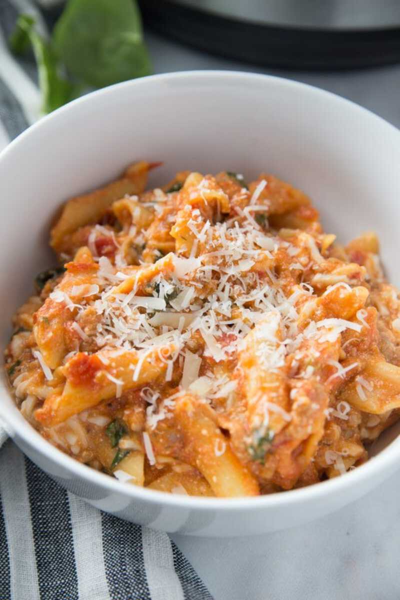 Pasta in white bowl with cheese