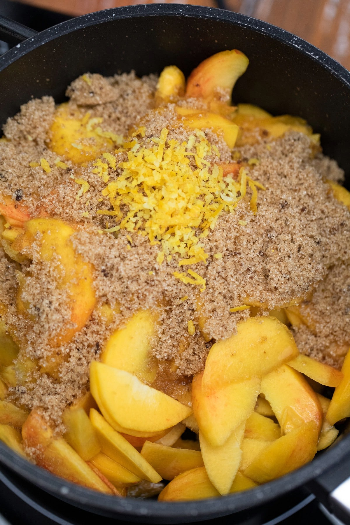 Sugar and peaches in cast iron skillet