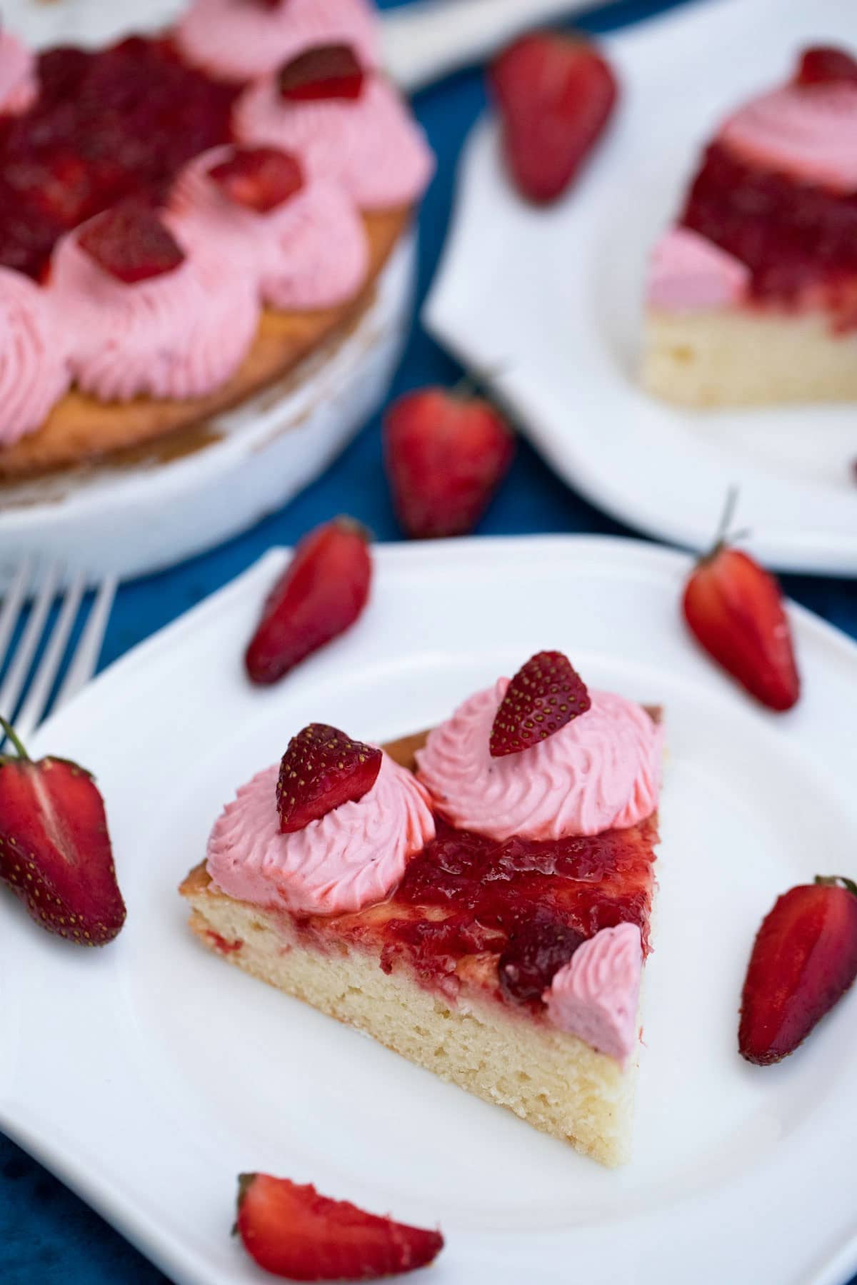 Sliced strawberry cake on plate