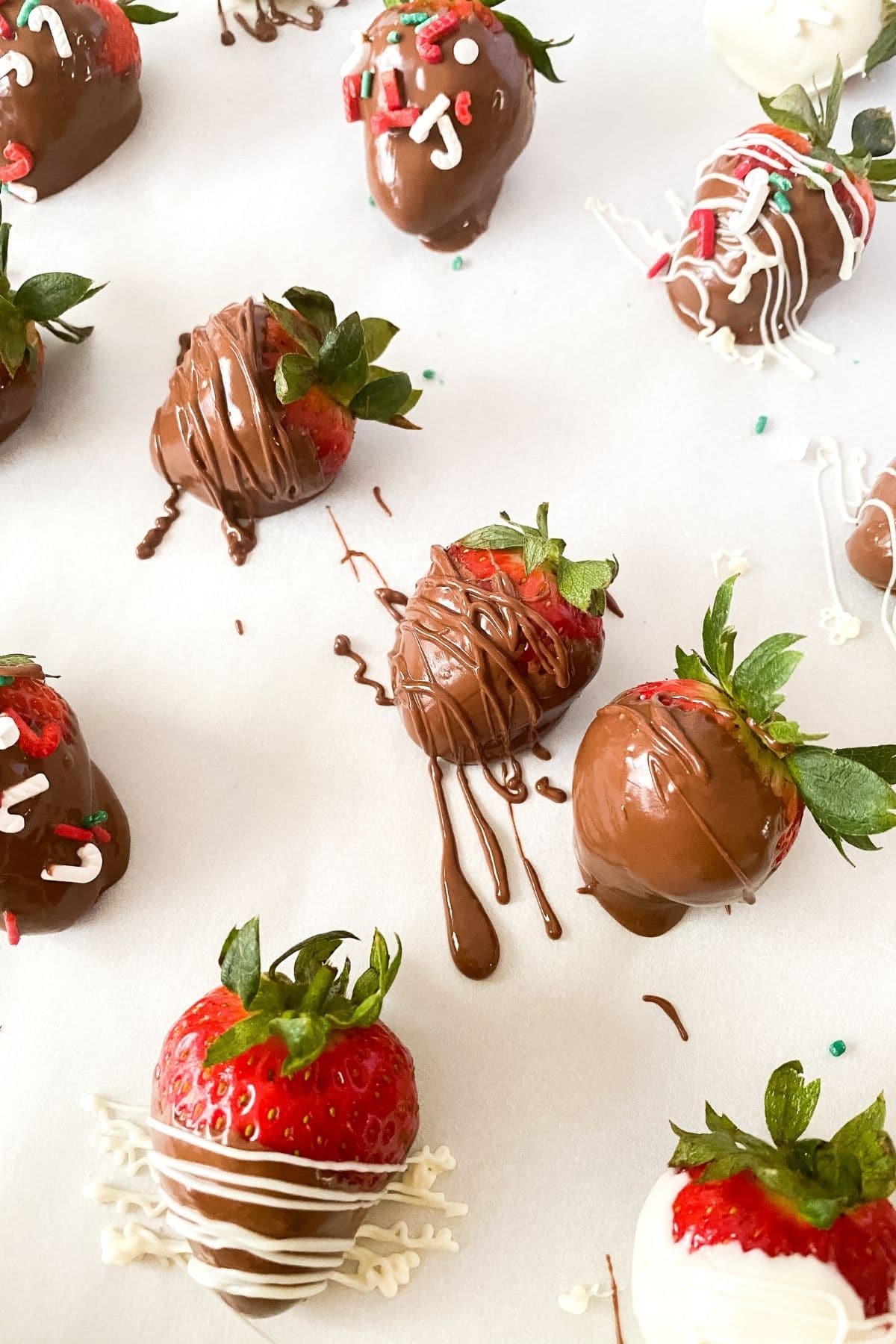 Adding toppings on chocolate strawberries