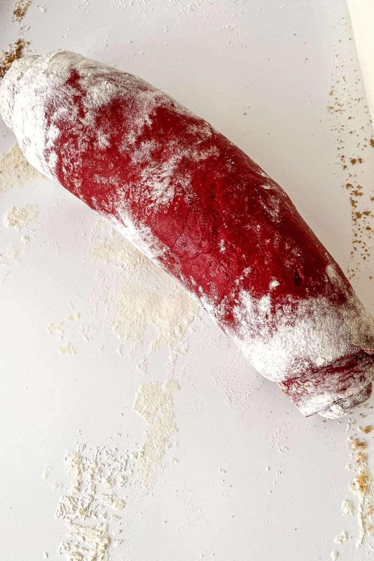 Roll of red velvet cinnamon roll dough