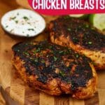 Blackened chicken breasts on cutting board