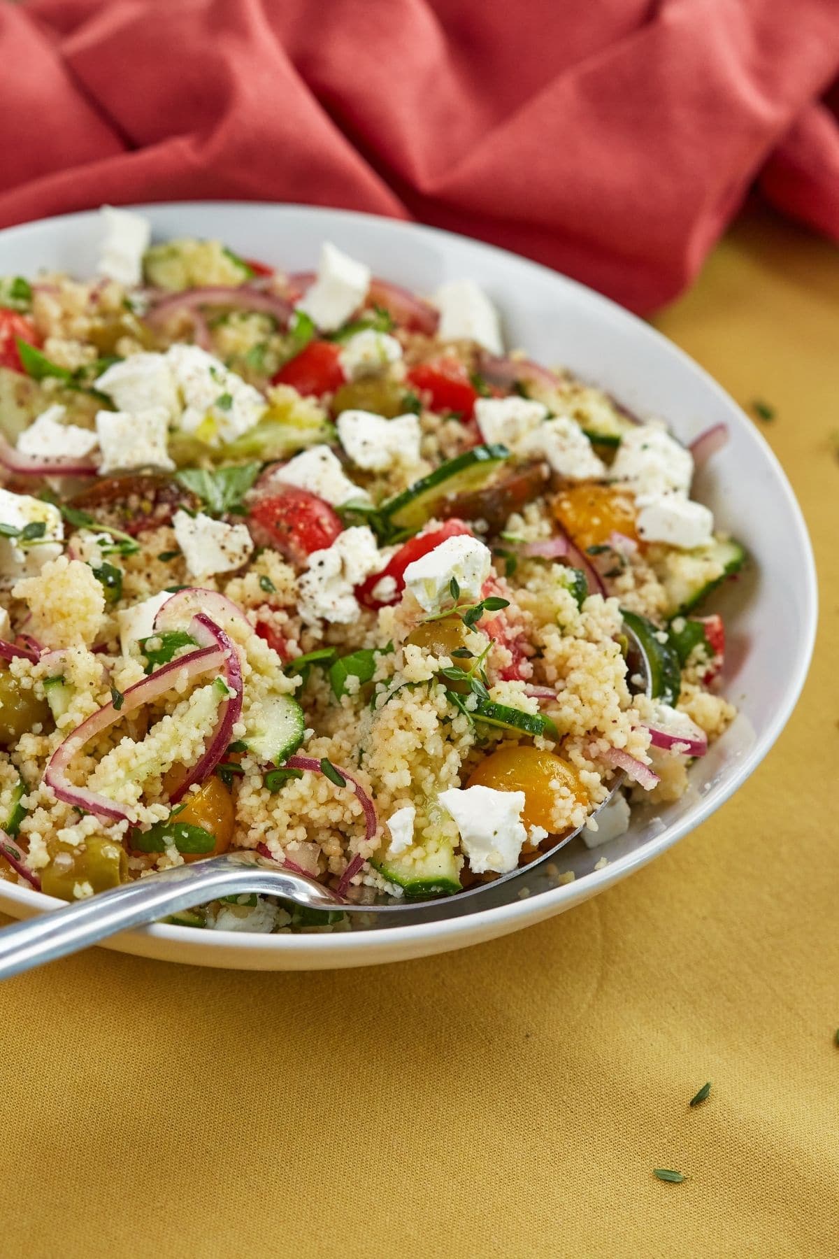 Couscous salad in white bowl