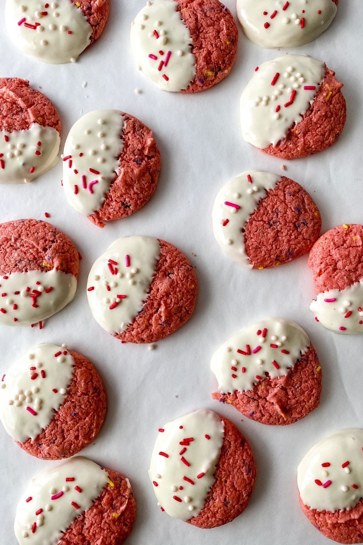 Dipped strawberry cookies on tray