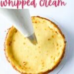 Piping whipped cream onto cheesecake