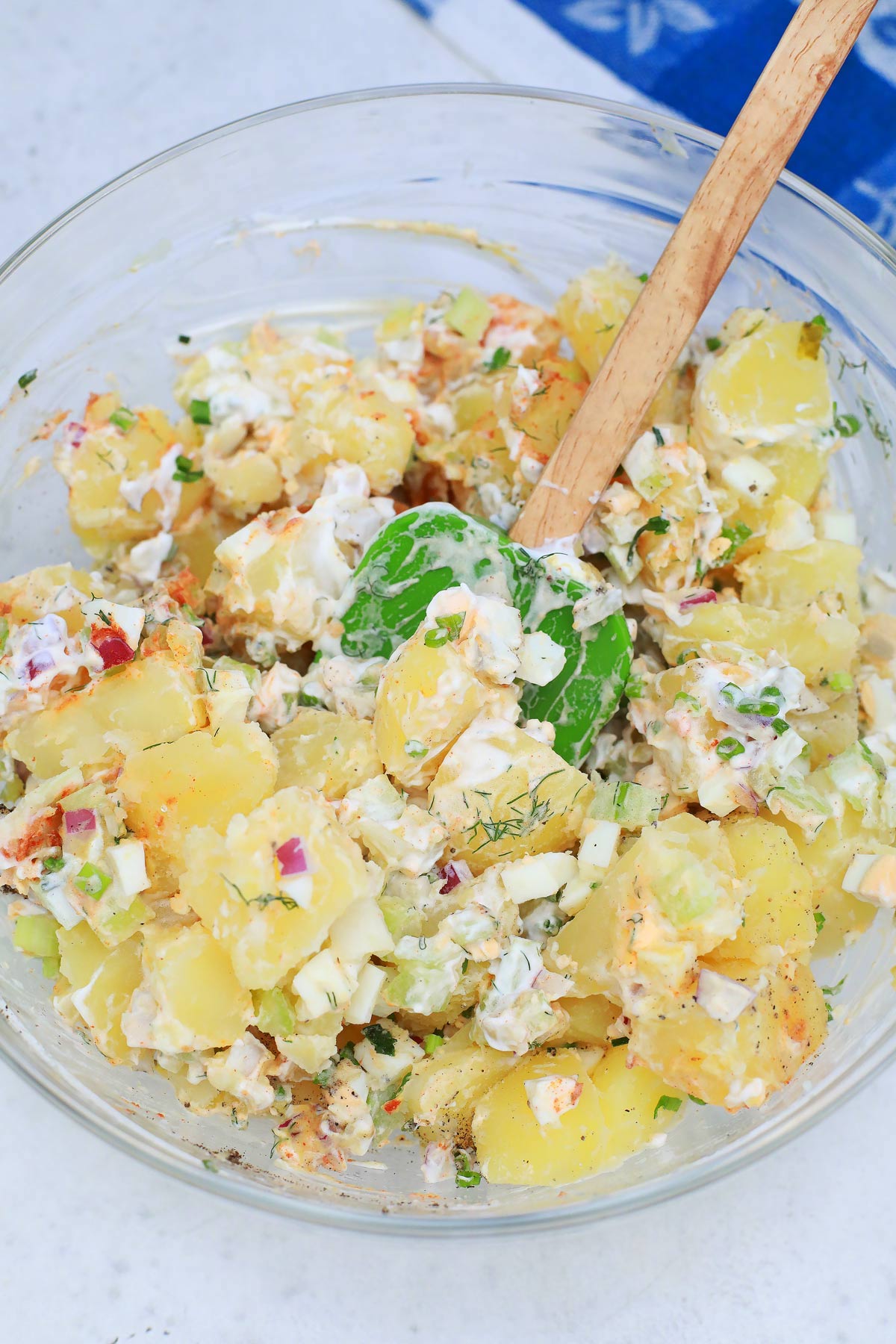 Mixing potato salad