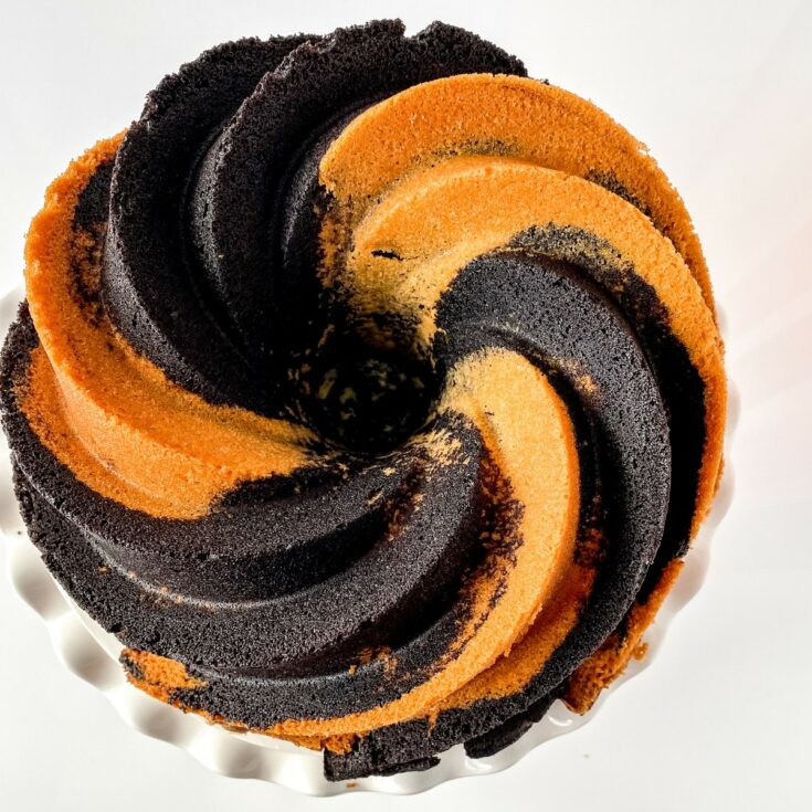 Chocolate vanilla swirl bundt cake on cake stand