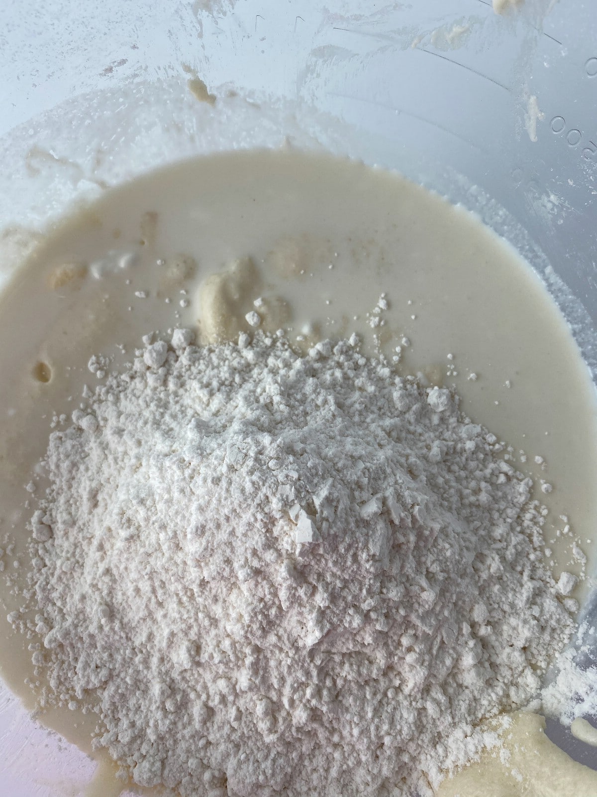 Adding flour to bowl