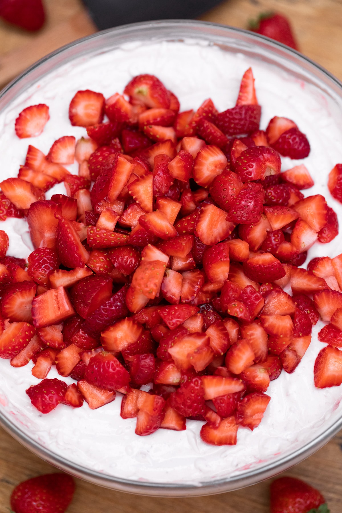 Adding strawberries to cheesecake filling