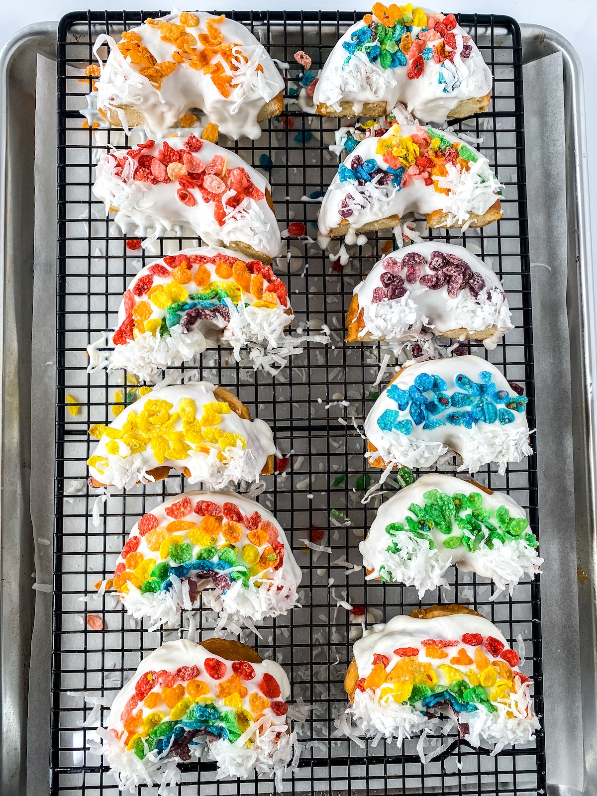 Rainbow donuts on cooling rack