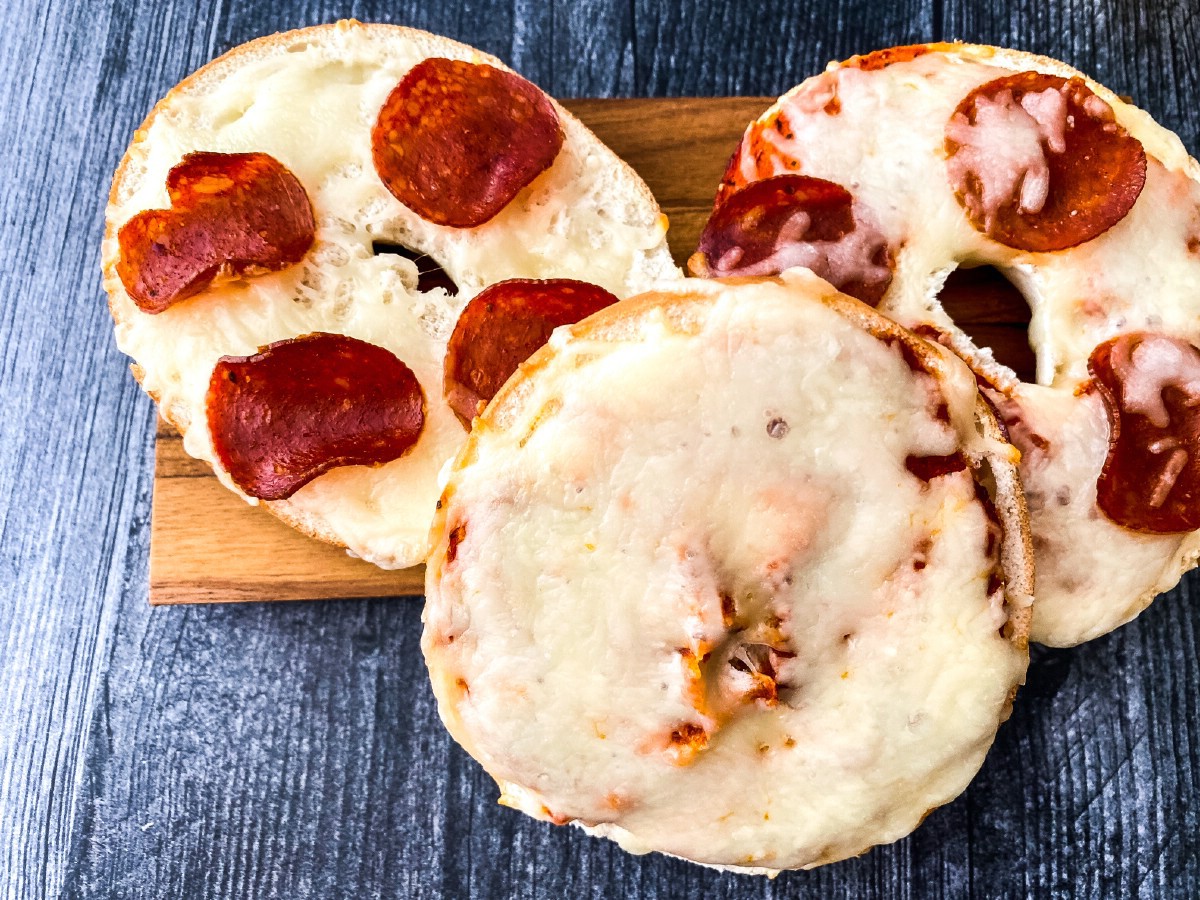 Mini pizzas on cutting board