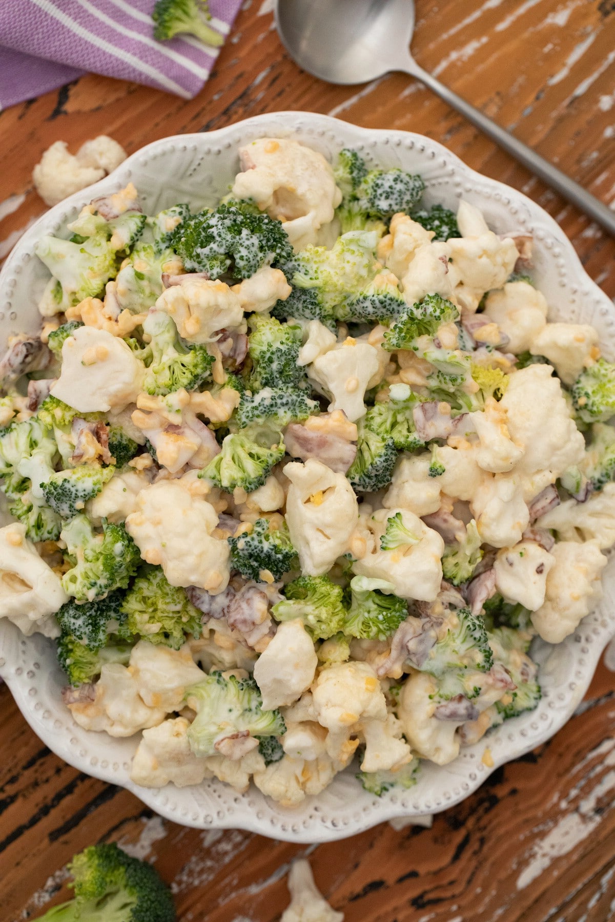 White bowl filled with broccoli salad