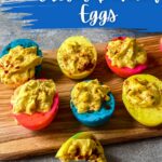 Cutting board with blue yellow and pink deviled eggs