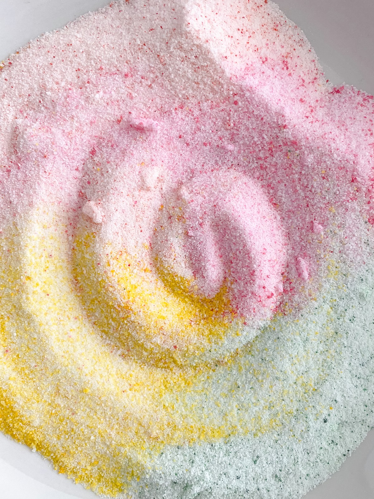 Colored sugar swirled together 