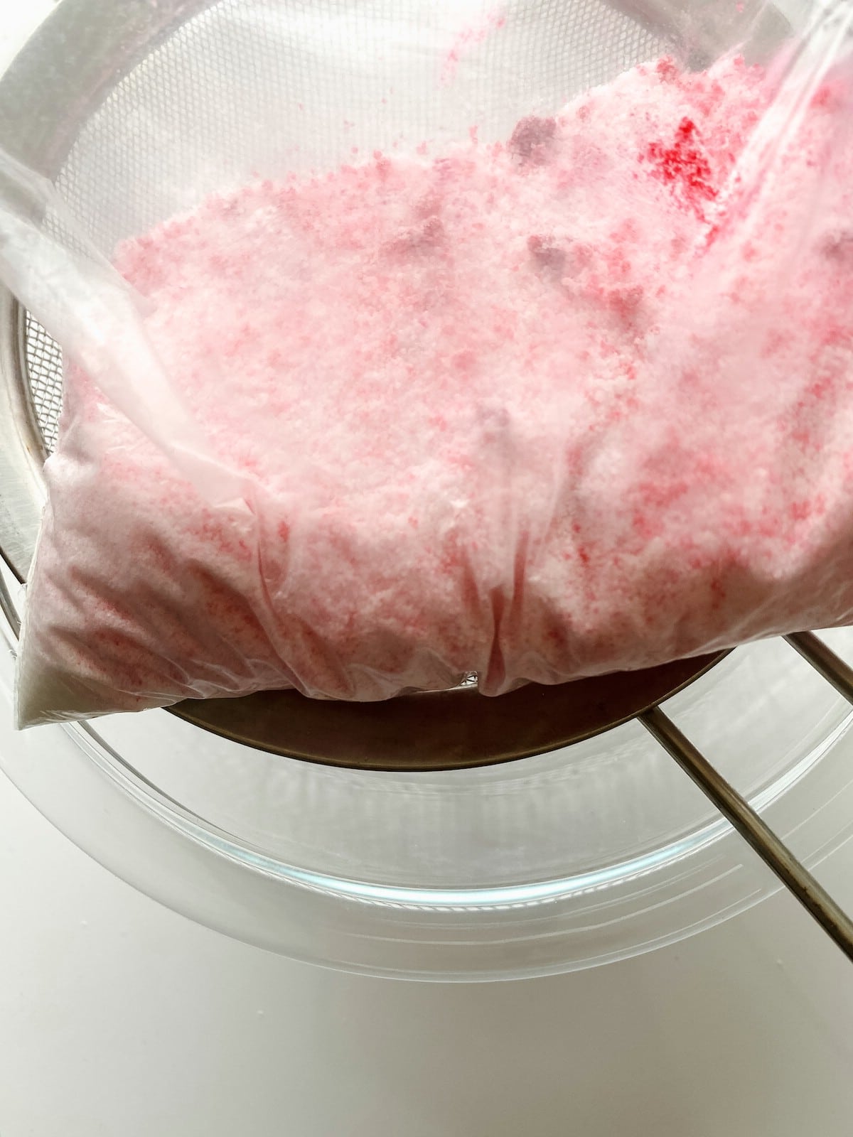 Sugar with pink color in Ziploc bag