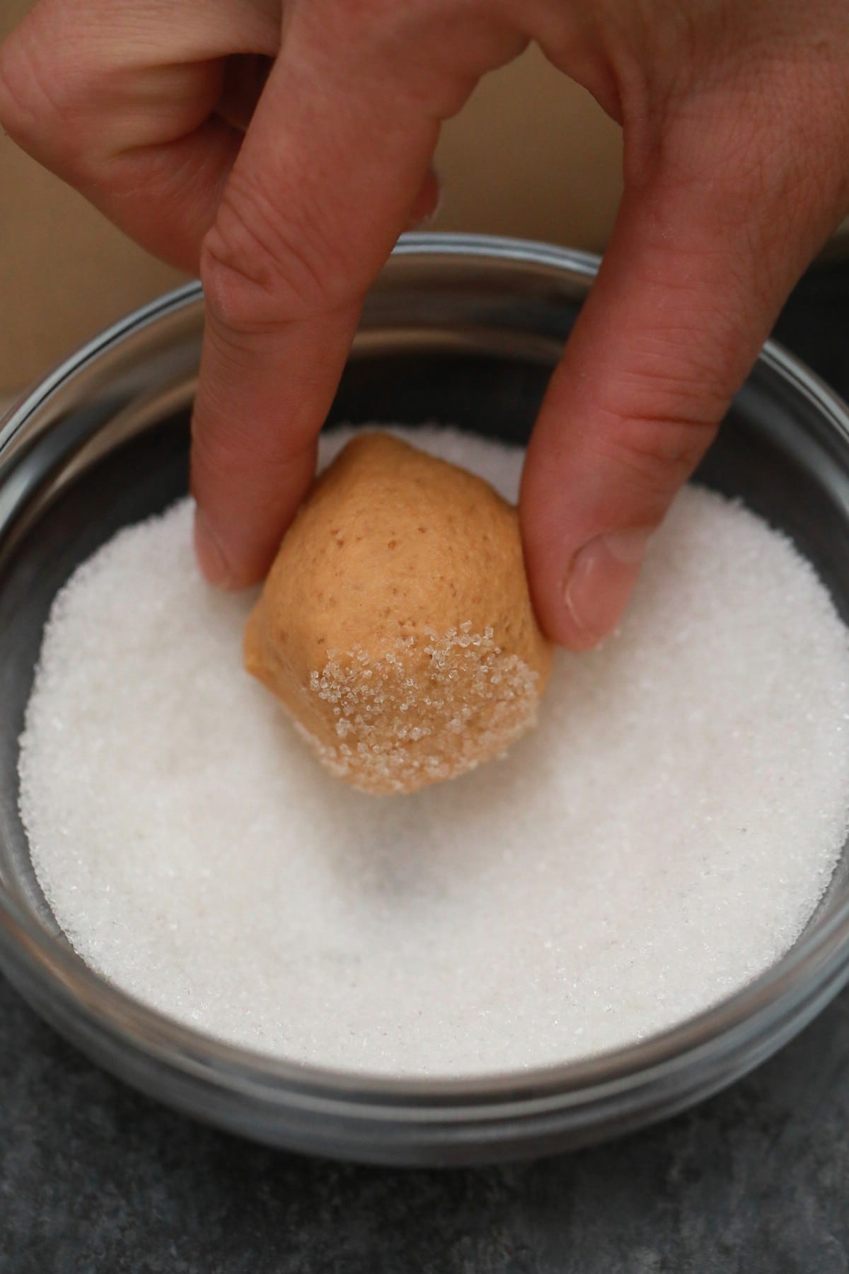 Rolling dough in sugar