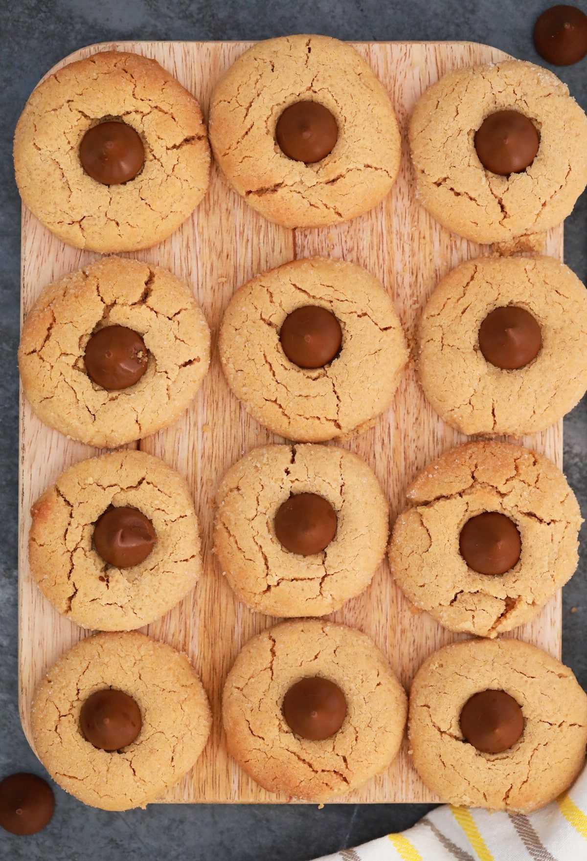 Baked peanut butter blossom cookies on cookie sheet