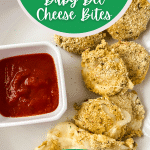 Cheese bites on plate with green banner saying air fryer baby bel cheese bites