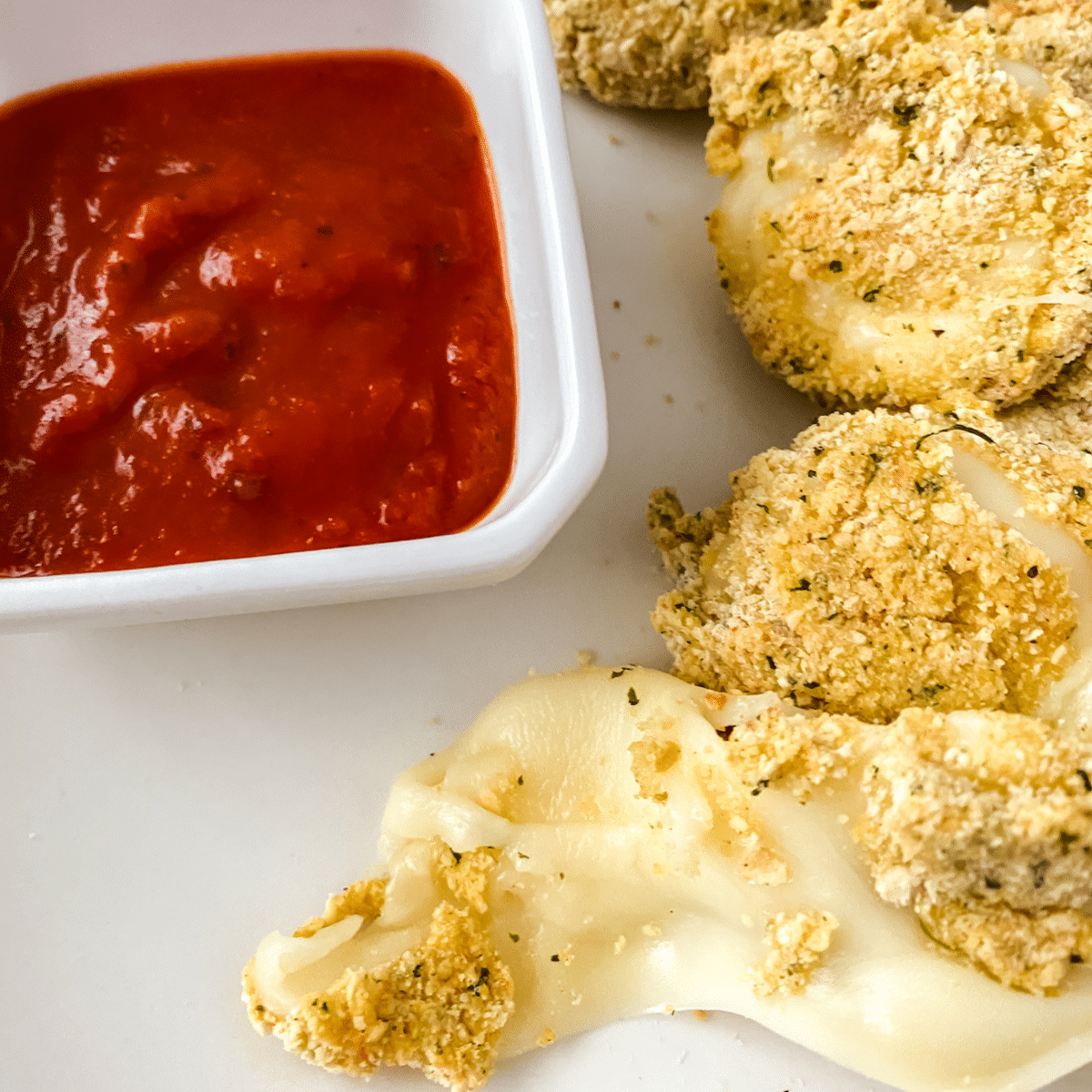 Coated cheese rounds on plate