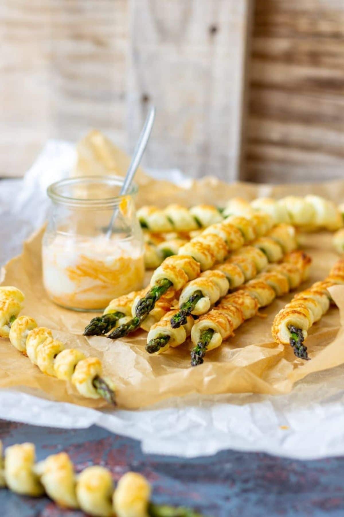 Pastry wrapped asparagus on cutting board