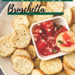 Bruschetta on white plate with green banner saying homemade bruschetta