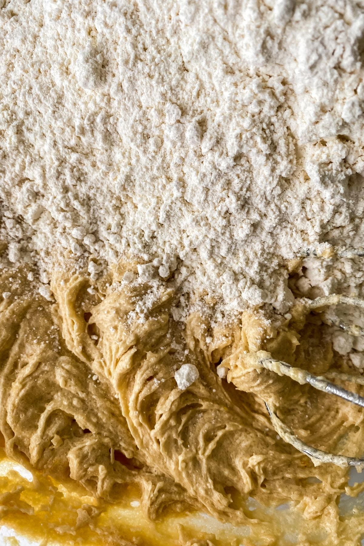 Adding flour to cookie dough
