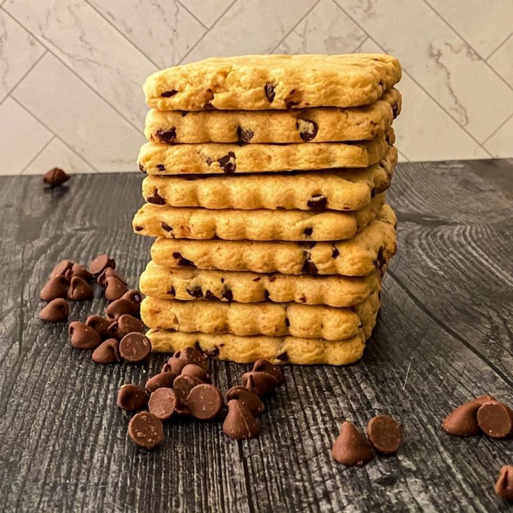 Stack of cut out cookies on black table