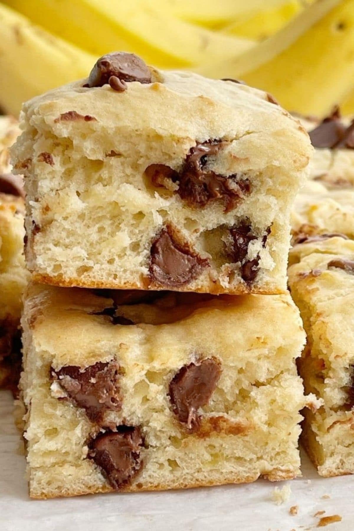 Cake mix cookie bars stacked with chocolate chips