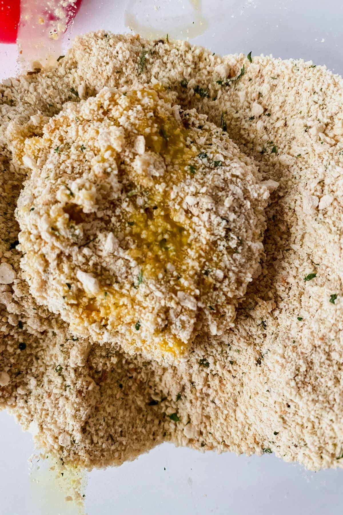 Cheese round coated with breadcrumbs