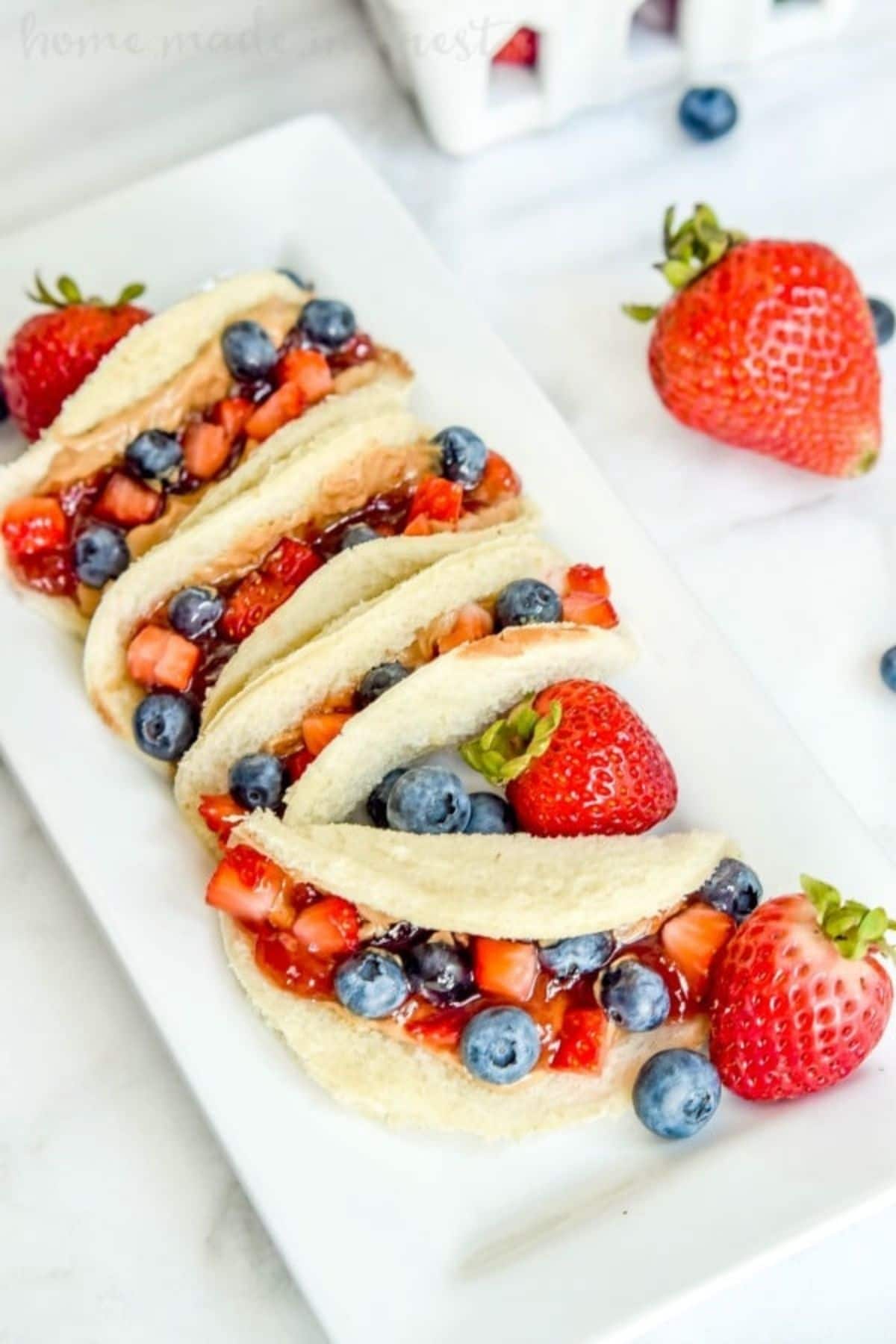 Peanut butter and jelly bread tacos with fresh fruit topping