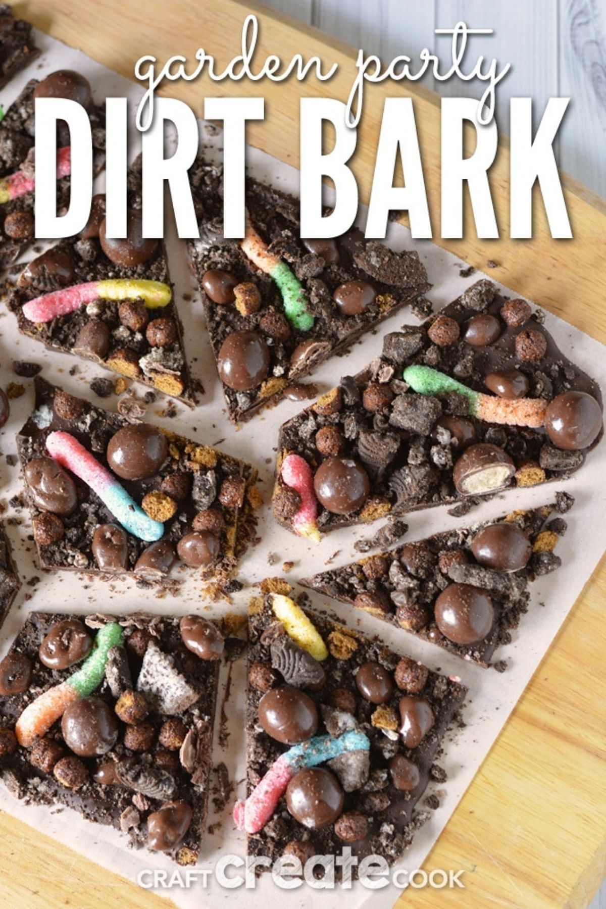 Dirt chocolate bark with gummy worms on cutting board