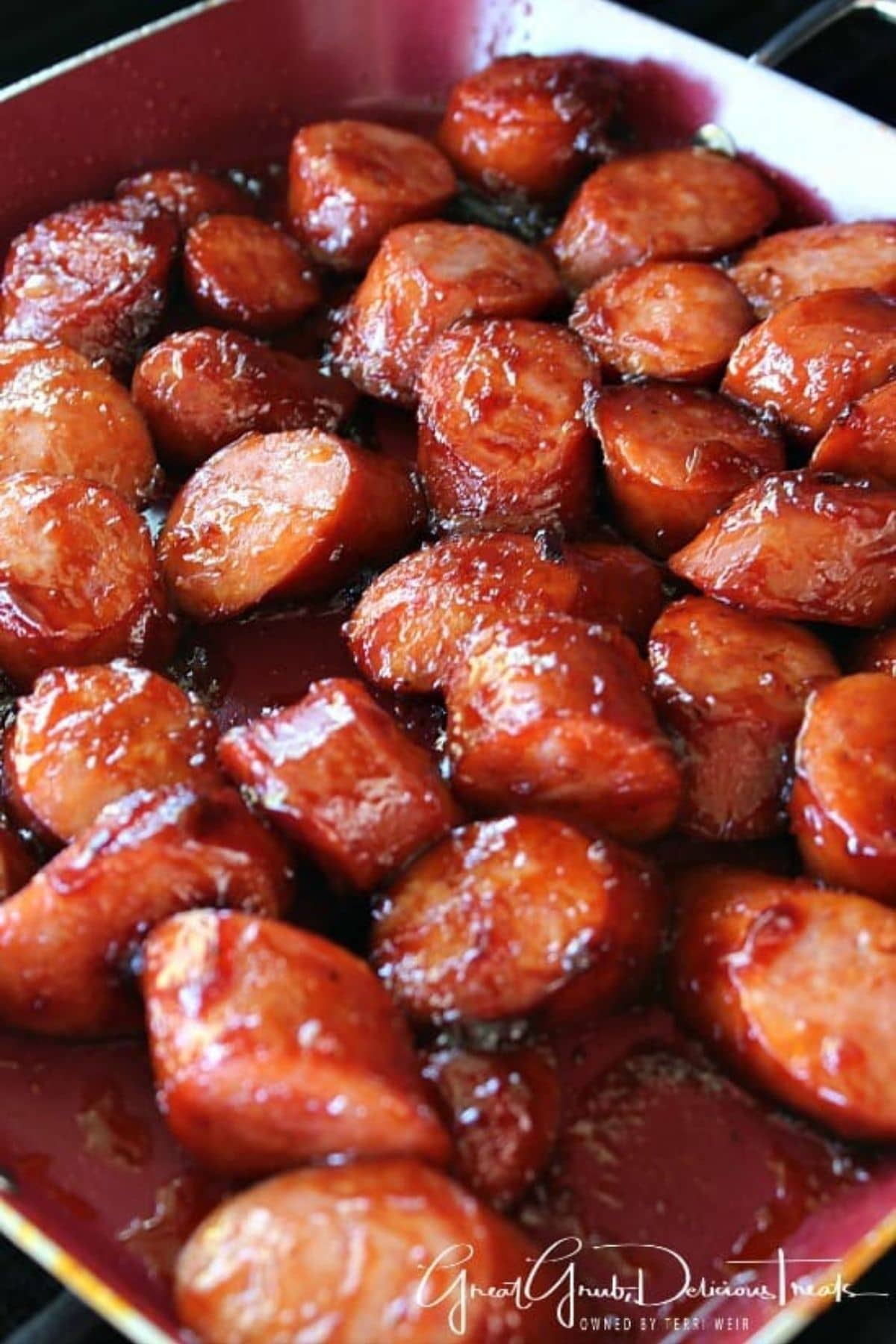 Smoked sausage in dish with barbecue sauce