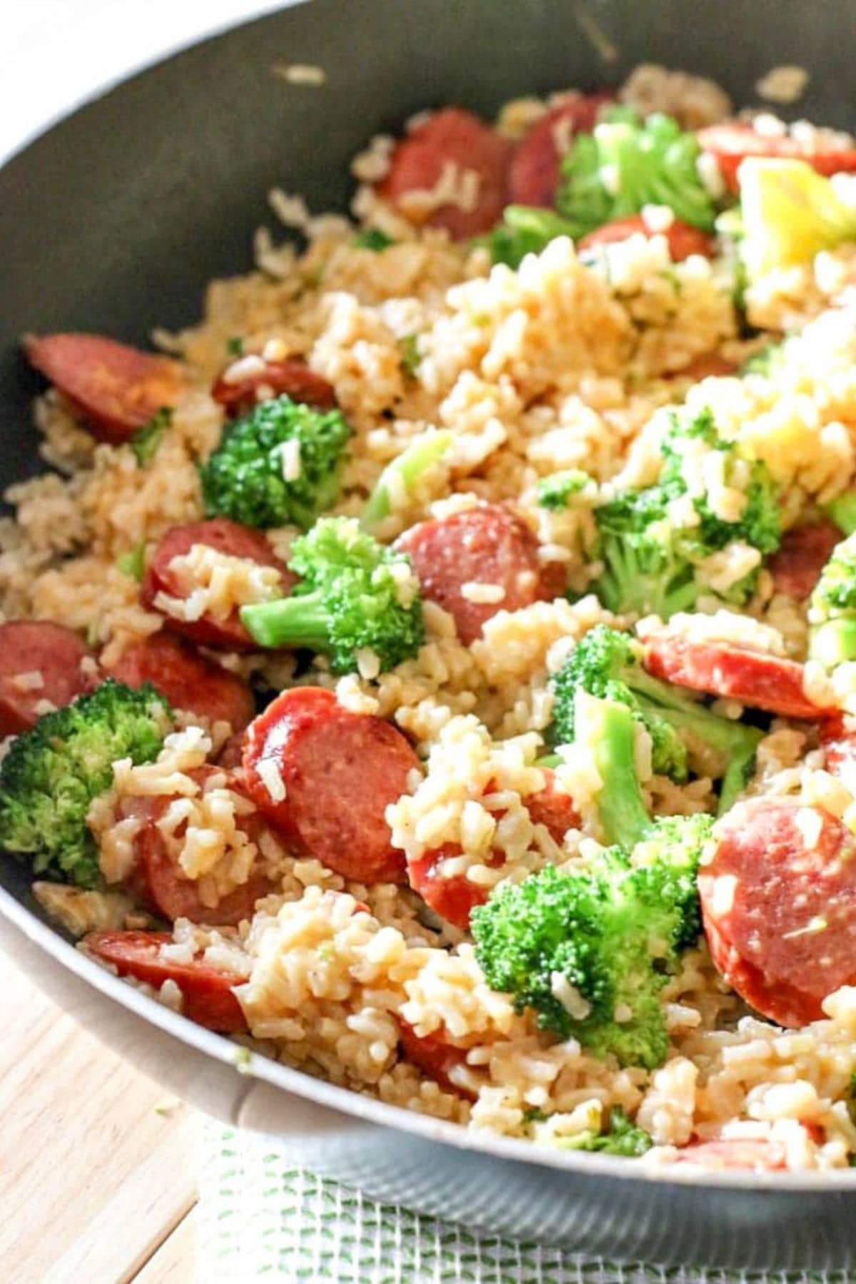 Rice in large bowl with broccoli and sausage
