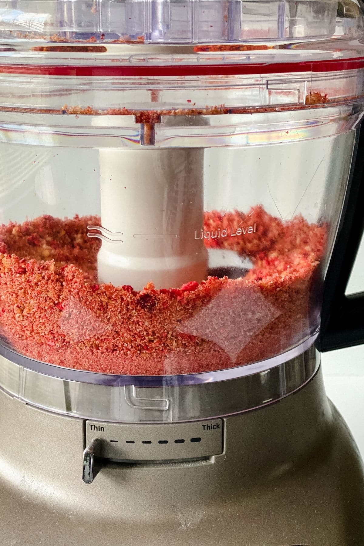 Strawberry cookie crumbs in food processor