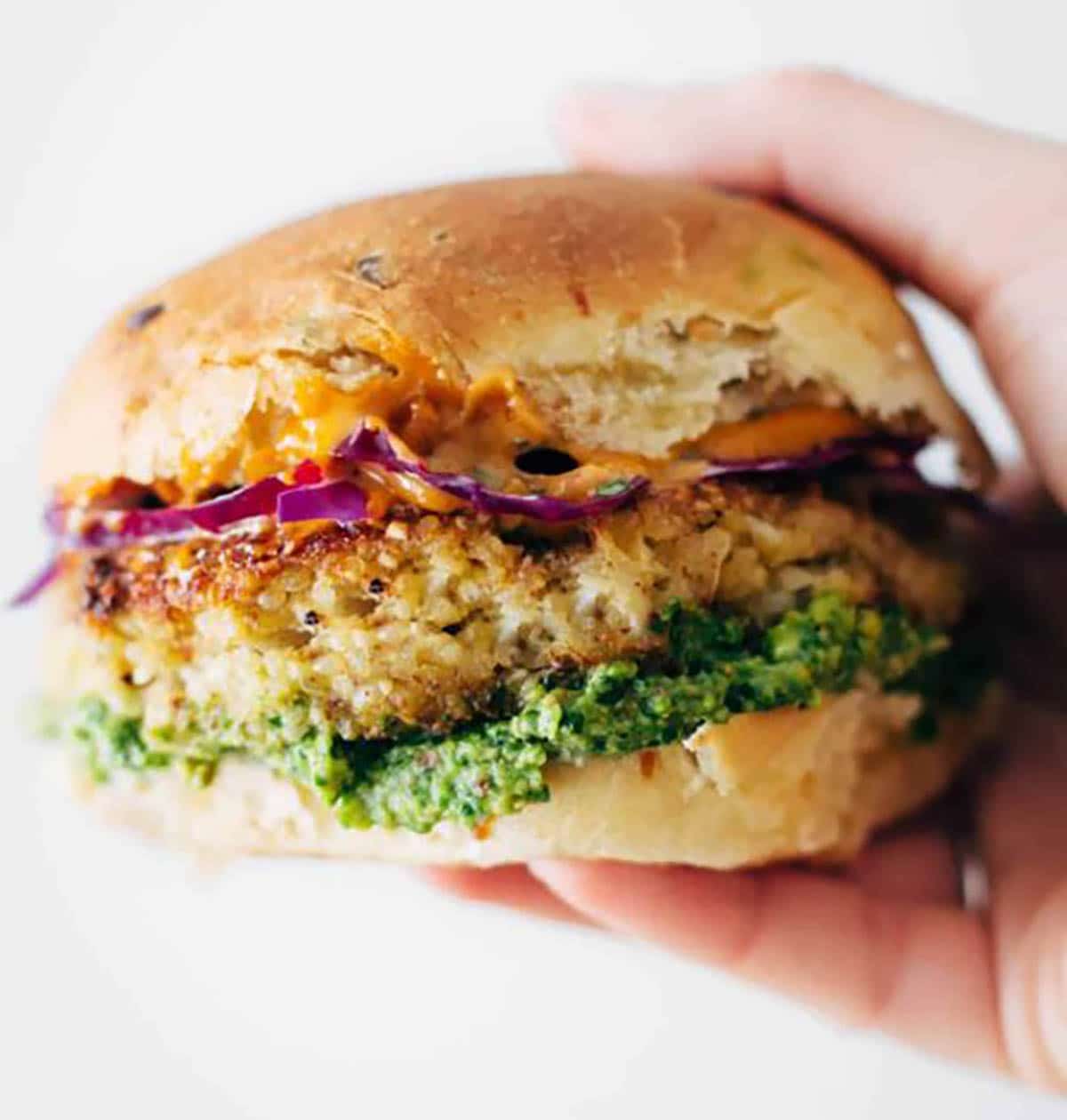 Cauliflower burgers with green sauce, cilantro and lime slaw, chipotle mayo and cheese