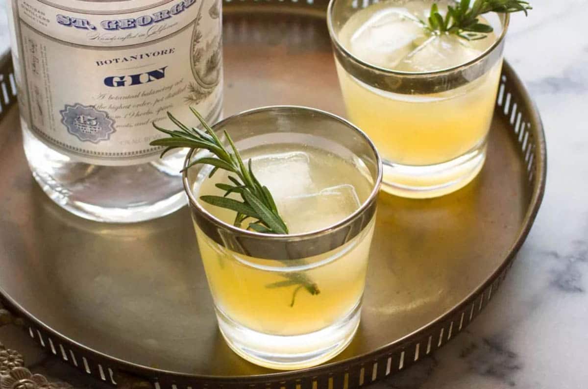 Charred Lemon and Rosemary Gin Sparkler Recipe topped with rosemary