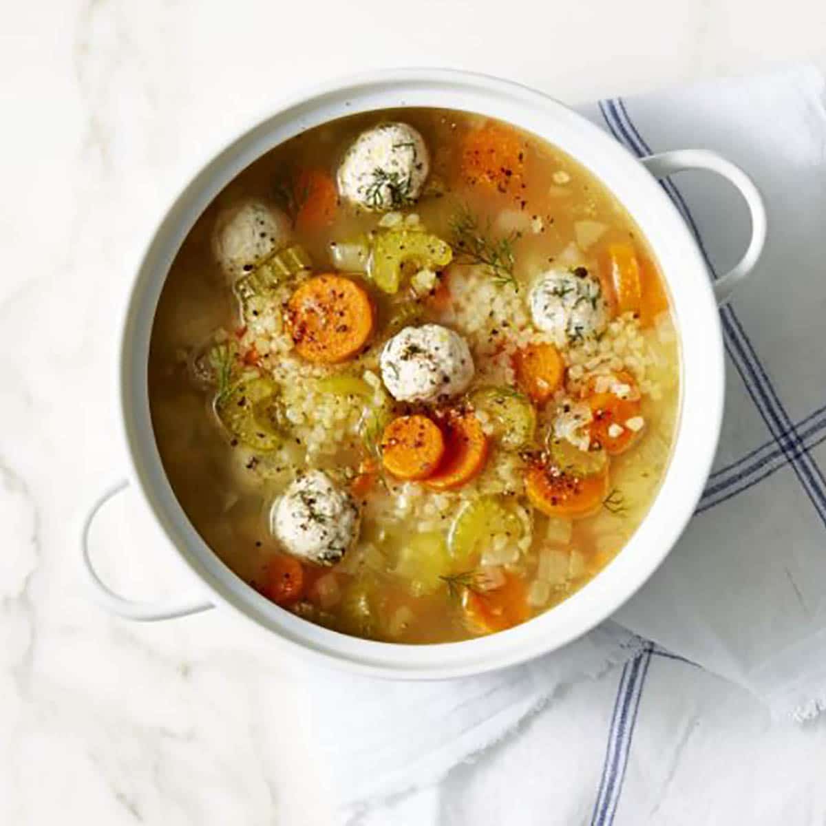 Chicken Meatball Soup with Lemon and Dill in a pot