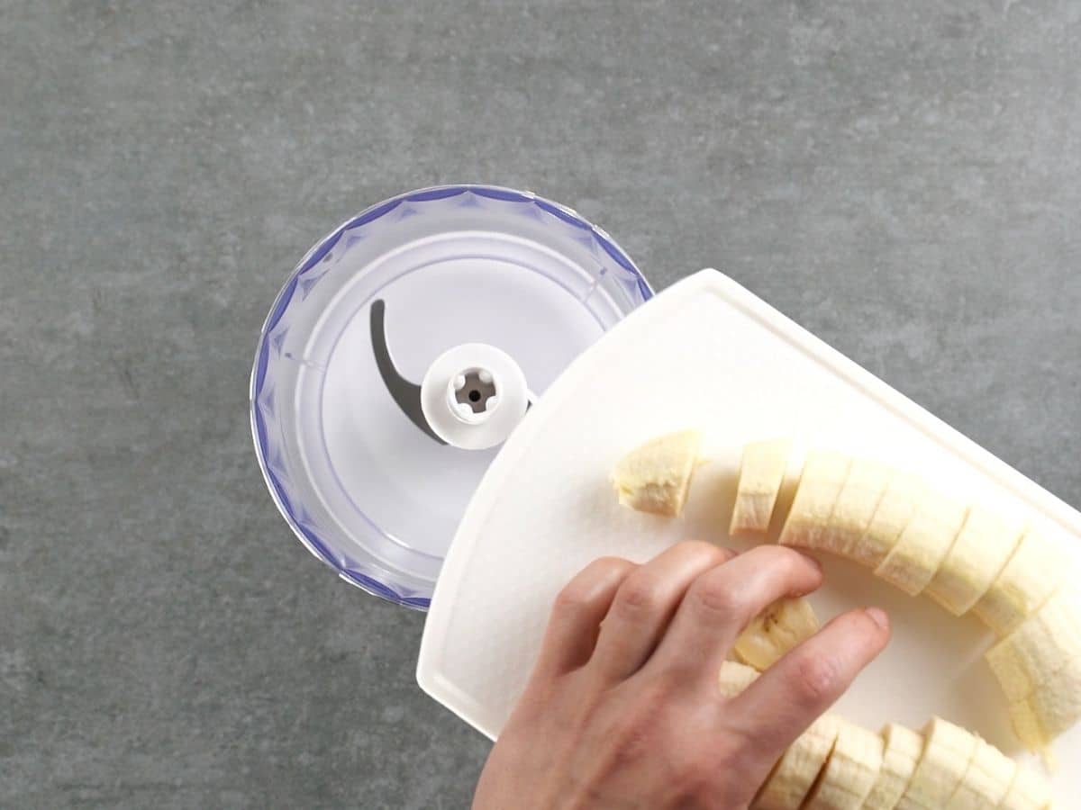 Pouring banana slices into food processor