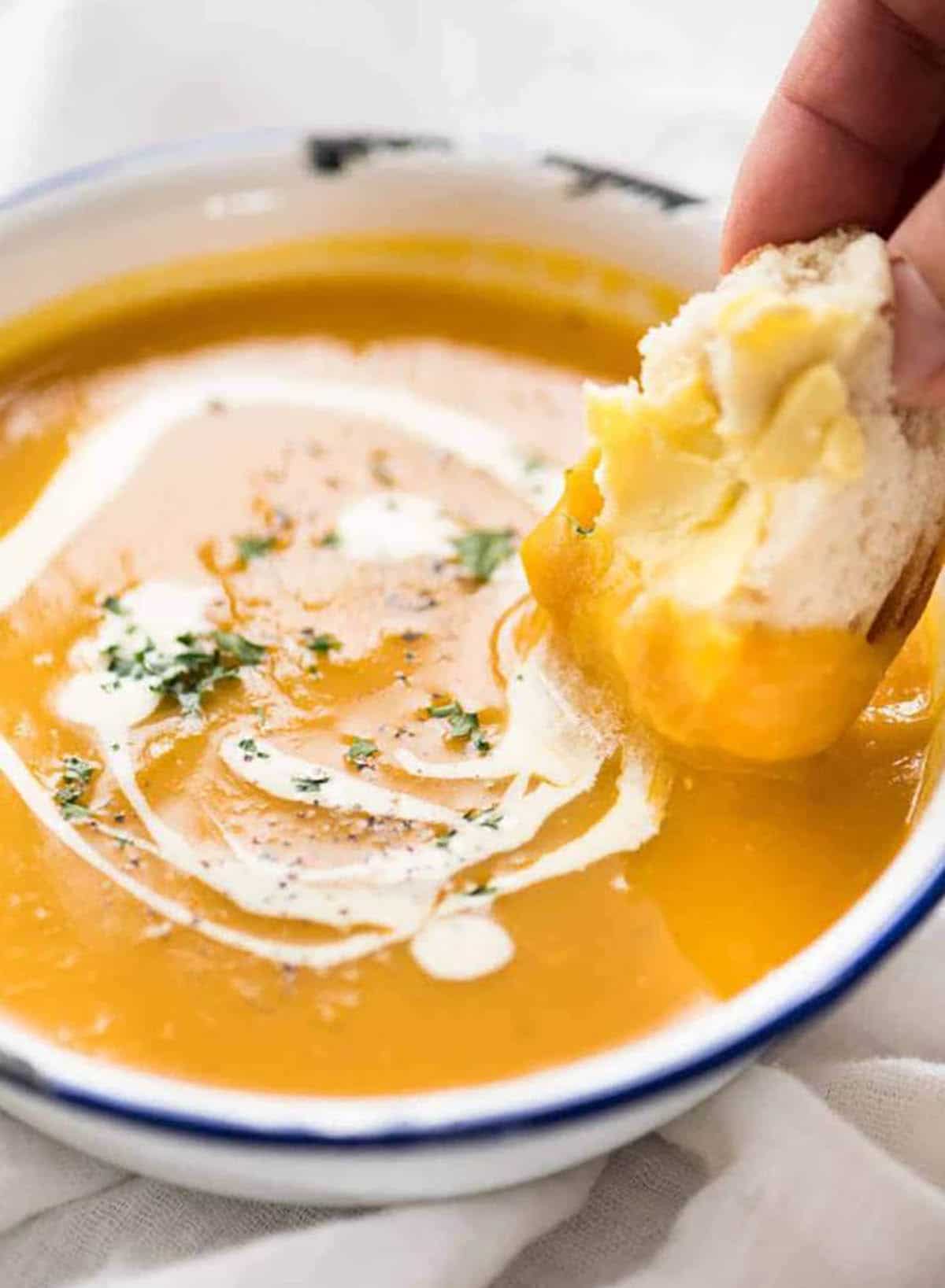 Classic Pumpkin Soup made with onion, garlic, milk/half and half cream, stock/broth, and pumpkin or pumpkin puree.