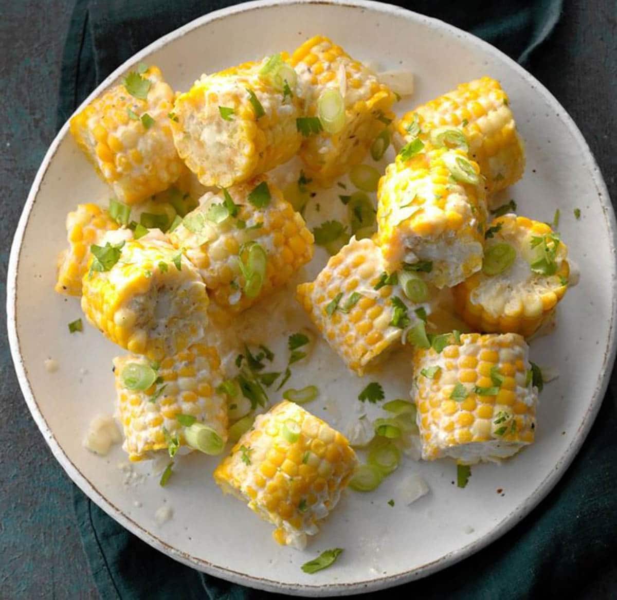 Corn on the Cob with coconut milk, thyme sprigs and cilantro 