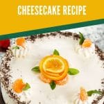 Cheesecake with orange rose in center on brown table with orange overlay that says no bake orange vanilla cheesecake recipe