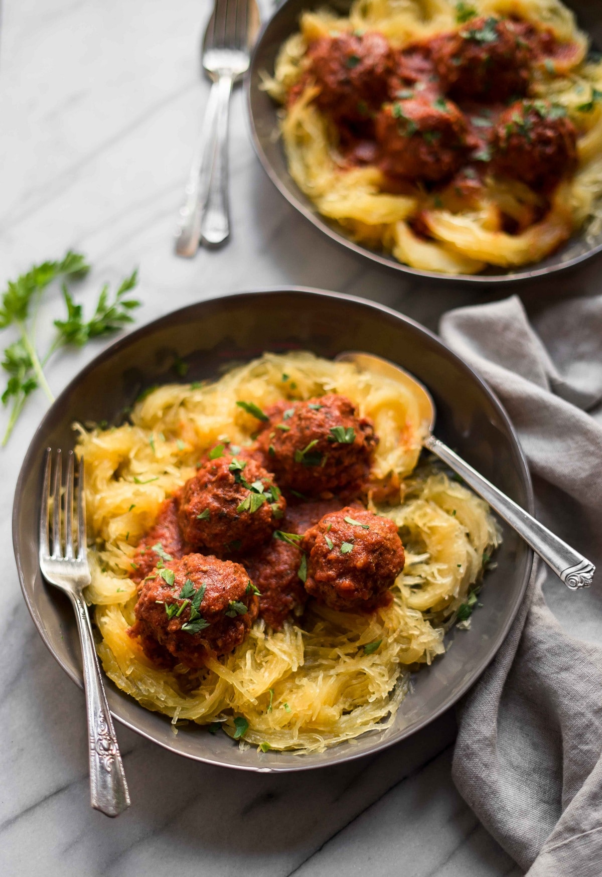 Instant pot meatballs on top of spaghetti squash noodles on a plate