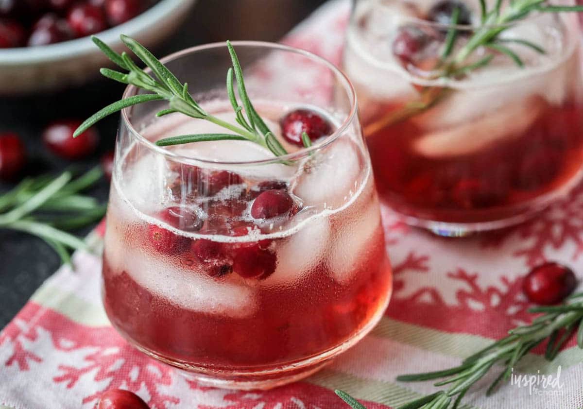 Maple Cranberry Bourbon Cocktail with pomegranate seeds and rosemary