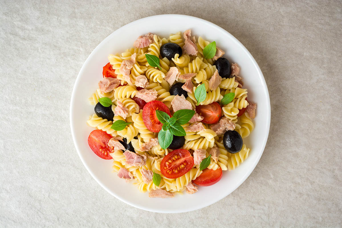 Mediterranean Pasta Salad with Tuna, Olives, Cherry Tomatoes, Thyme Leaves, Basil and red wine dressing