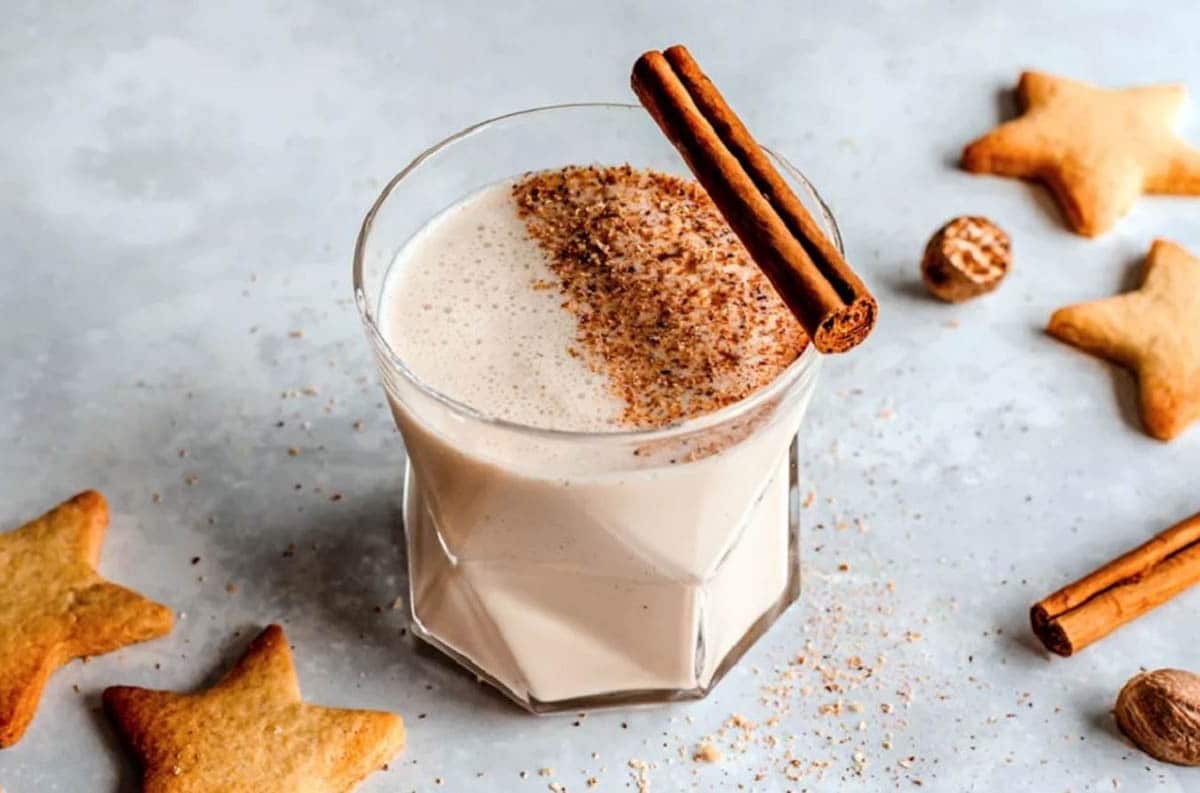 Puerto Rican No-Egg Eggnog With Rum topped with a cinnamon stick