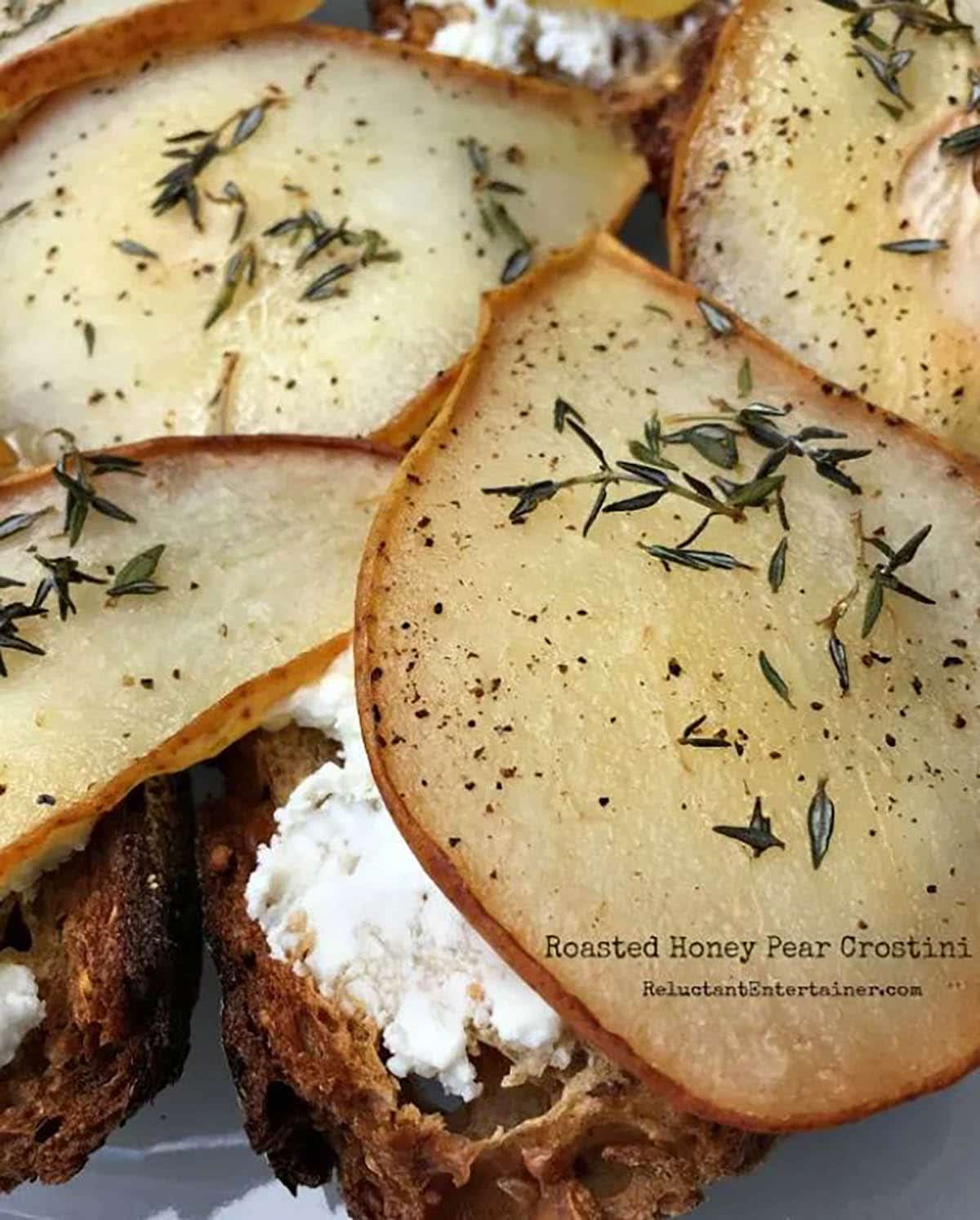 Roasted Honey Pear Crostini topped with rosemary 