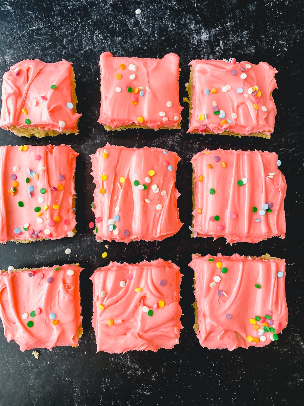 Pink frosted bars on black table