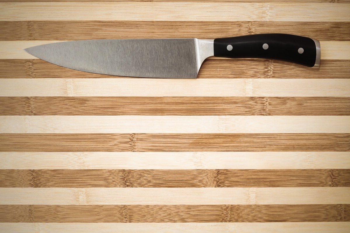 Chef's knife on a bamboo cutting board